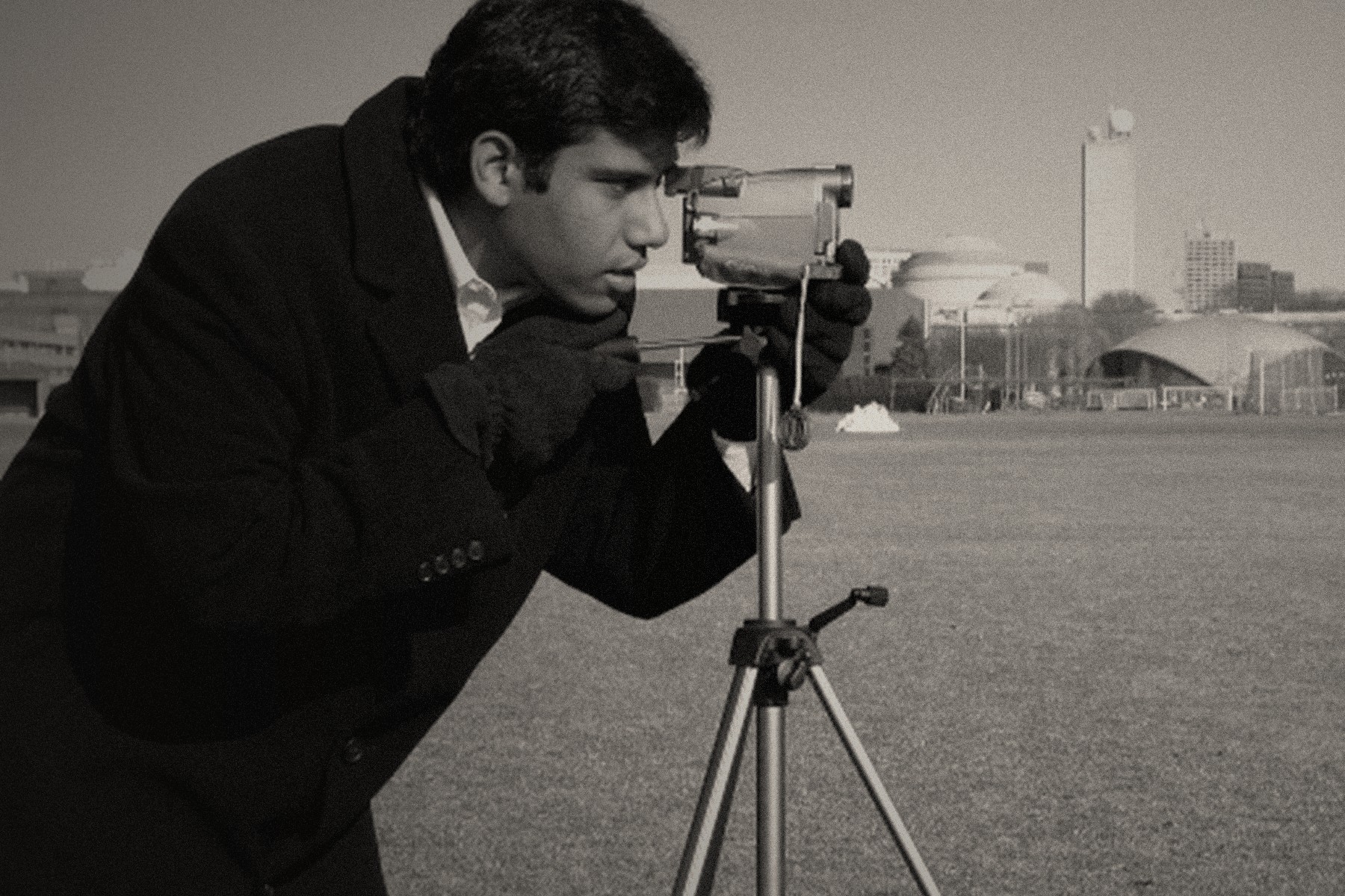 Documentary photographer behind a camera